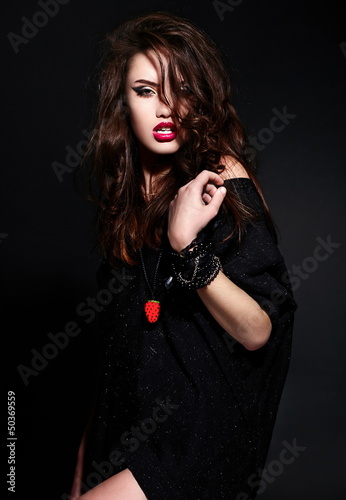 Photo: glamor stylish brunette model in black cloth with bright makeup glamor stylish brunette model in black cloth with bright makeup