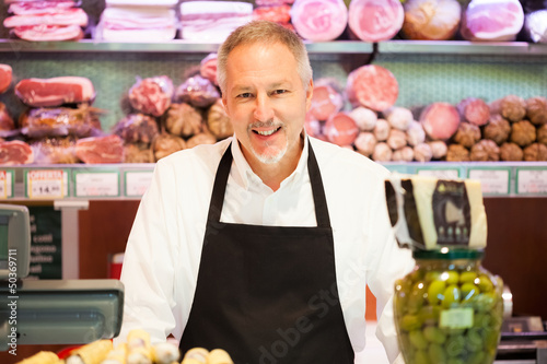 Photo: Smiling shopkeeper Smiling shopkeeper
