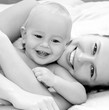 Mother and daughter play in the bedroom