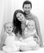 Happy young family. Indoors.
