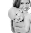 Young mother hugging baby