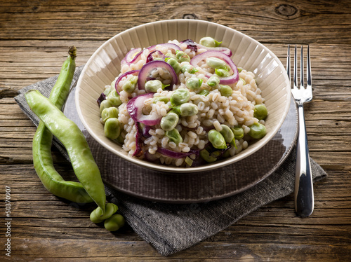 Photo: barley risotto with beans broad and onions, vegetarian food barley risotto with beans broad and onions, vegetarian food