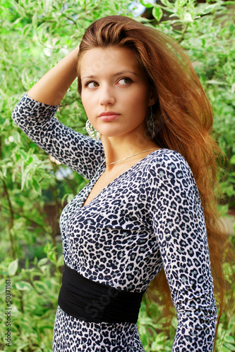Photo: Portrait of young beautiful redhead woman Portrait of young beautiful redhead woman