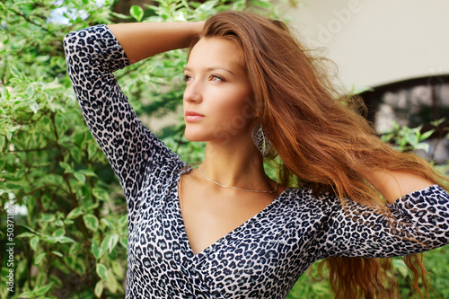 Photo: Portrait of young beautiful redhead woman Portrait of young beautiful redhead woman