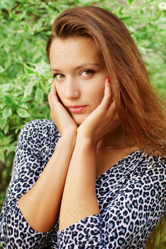 Photo: Portrait of young beautiful redhead woman Portrait of young beautiful redhead woman