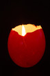 Red egg shell used as a candle holder