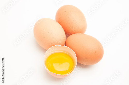 Photo: Three eggs with a yolk in half a shell Three eggs with a yolk in half a shell