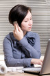 Woman  with laptop and phones