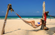 Woman in hammock on beach
