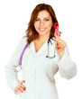 Photo: A young nurse with an aids ribbon, focus on her hand A young nurse with an aids ribbon, focus on her hand