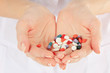 Close-up of doctor holding a pills in the hands