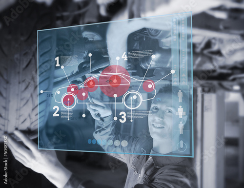 Illustration: Mechanic reparing car while looking at futuristic interface Mechanic reparing car while looking at futuristic interface