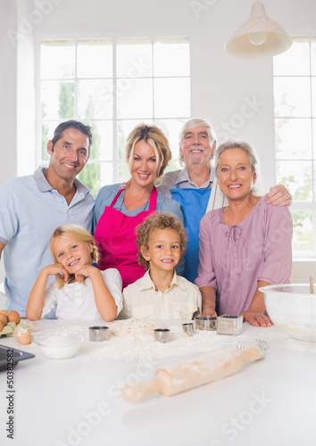Photo: Smiling family preparing to cook Smiling family preparing to cook
