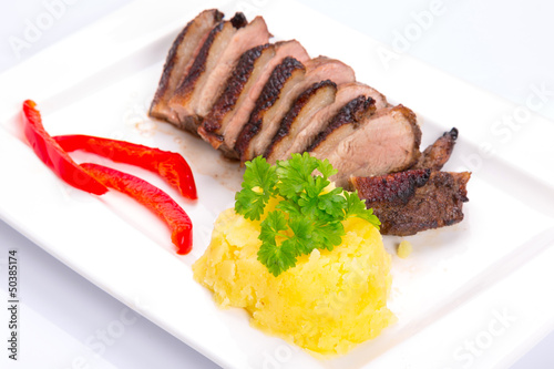 Photo: Roasted duck breast with potatoes and red peppers Roasted duck breast with potatoes and red peppers