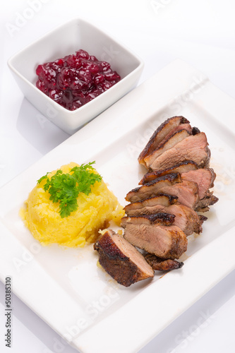 Photo: Roasted duck breast with potatoes and cranberry sauce Roasted duck breast with potatoes and cranberry sauce