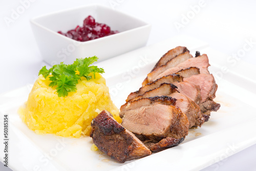 Photo: Roasted duck breast with potatoes and cranberry sauce Roasted duck breast with potatoes and cranberry sauce