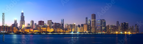 Photo: Chicago skyline panorama across Lake Michigan at sunset, IL, USA Chicago skyline panorama across Lake Michigan at sunset, IL, USA