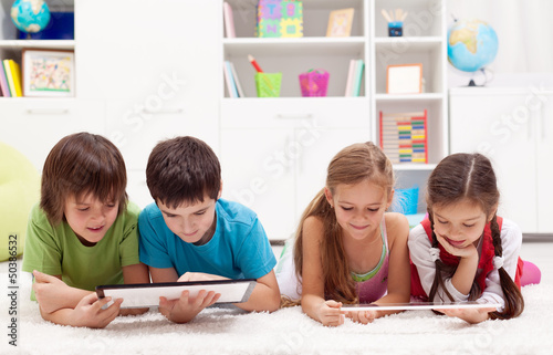 Photo: Kids using tablet computers Kids using tablet computers