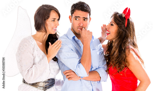 Photo: Business man getting good and bad advice Business man getting good and bad advice