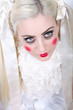Photo: Girl with dolly makeup and blue eyes Girl with dolly makeup and blue eyes