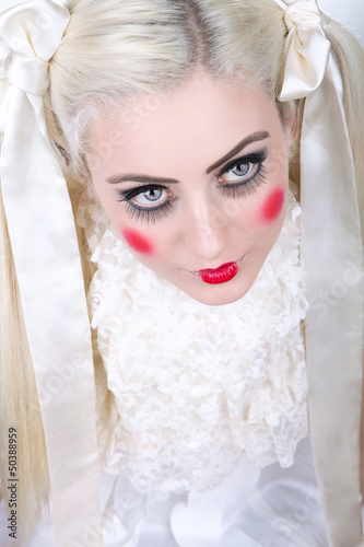 Photo: Girl with dolly makeup and blue eyes Girl with dolly makeup and blue eyes