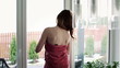 Woman in towel stretching in home, steadicam shot