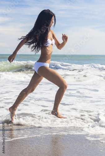 Photo: Sexy Woman Girl in Bikini Running on Beach Sexy Woman Girl in Bikini Running on Beach