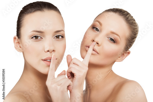 Photo: women making a hush gesture women making a hush gesture
