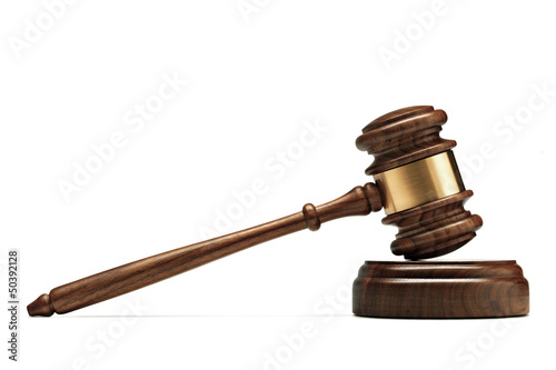Photo: A wooden judge gavel and soundboard isolated on white background A wooden judge gavel and soundboard isolated on white background