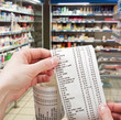 hand holds the check from supermarket
