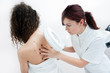 Photo: woman at dermatology examination woman at dermatology examination