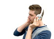 young man enjoying music with white headset