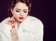 Glamour portrait of beautiful woman model  in luxury fur coat ov