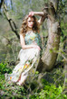 beautiful girl in green wood by summer