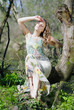 beautiful girl in green wood by summer