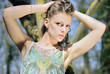 beautiful girl in green wood by summer
