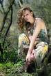 beautiful girl in green wood by summer