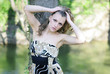 beautiful girl in green wood by summer