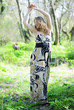 beautiful girl in green wood by summer