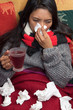 sick woman with handkerchief and tea