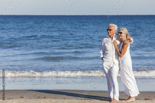 Photo: Happy Senior Couple Embracing on Tropical Beach Happy Senior Couple Embracing on Tropical Beach