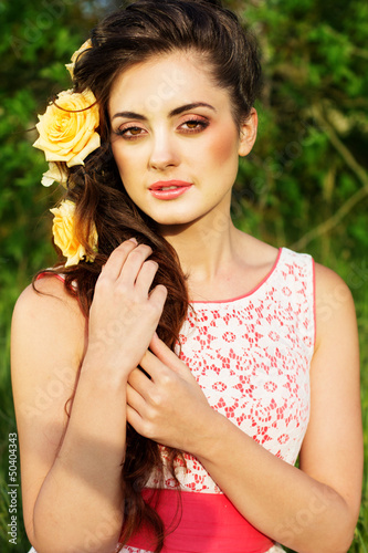 Photo: Beautiful woman with flowers in her hair Beautiful woman with flowers in her hair