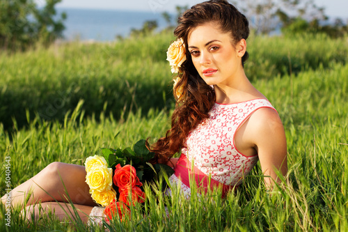 Photo: Beautiful woman with flowers in her hair Beautiful woman with flowers in her hair