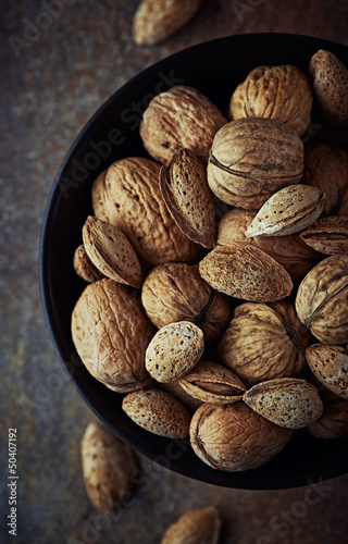 Photo: Bowl of rustic walnuts and almonds Bowl of rustic walnuts and almonds