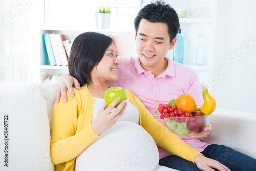 Photo: Pregnant woman eating fruits Pregnant woman eating fruits