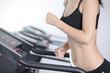 Asian girl slim body likes to run in the simulator