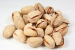 Pistachios heap against white background