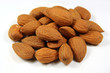 Almonds heap against white background