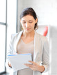 happy woman with big notepad