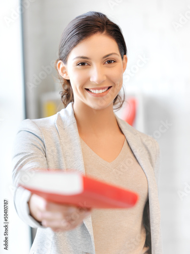 Photo: happy and smiling woman with book happy and smiling woman with book